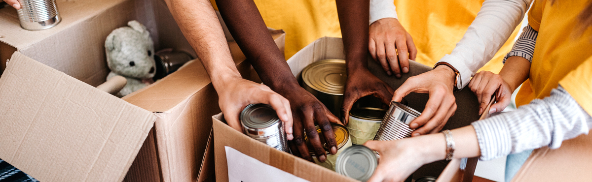 Volunteers collect canned goods for charity.